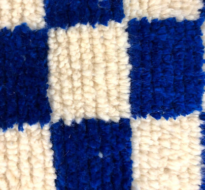 Handmade Moroccan Berber wool blue and white checkered rug.