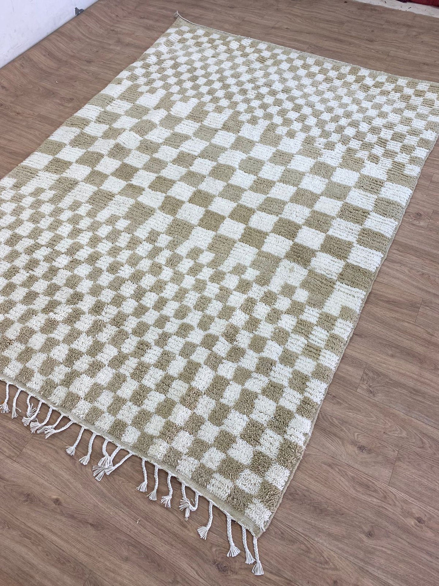 Checkered Beige and white area rug.