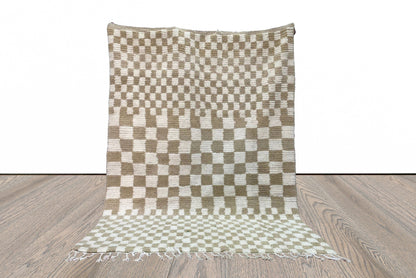 Checkered Beige and white area rug.