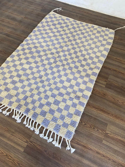 Light purple moroccan berber wool checkered area rug.